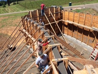 Studs and framing of board-formed concrete walls of Fairsing Vineyard
