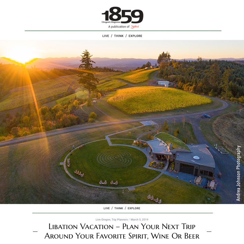 High above the Fairsing Vineyard tasting room and meditative labyrinth as the sun sets behind the Coastal Mountain Range in Oregon's Willamette Valley as featured in the 1859 Oregon's Magazine March edition article "Libation Vacation".