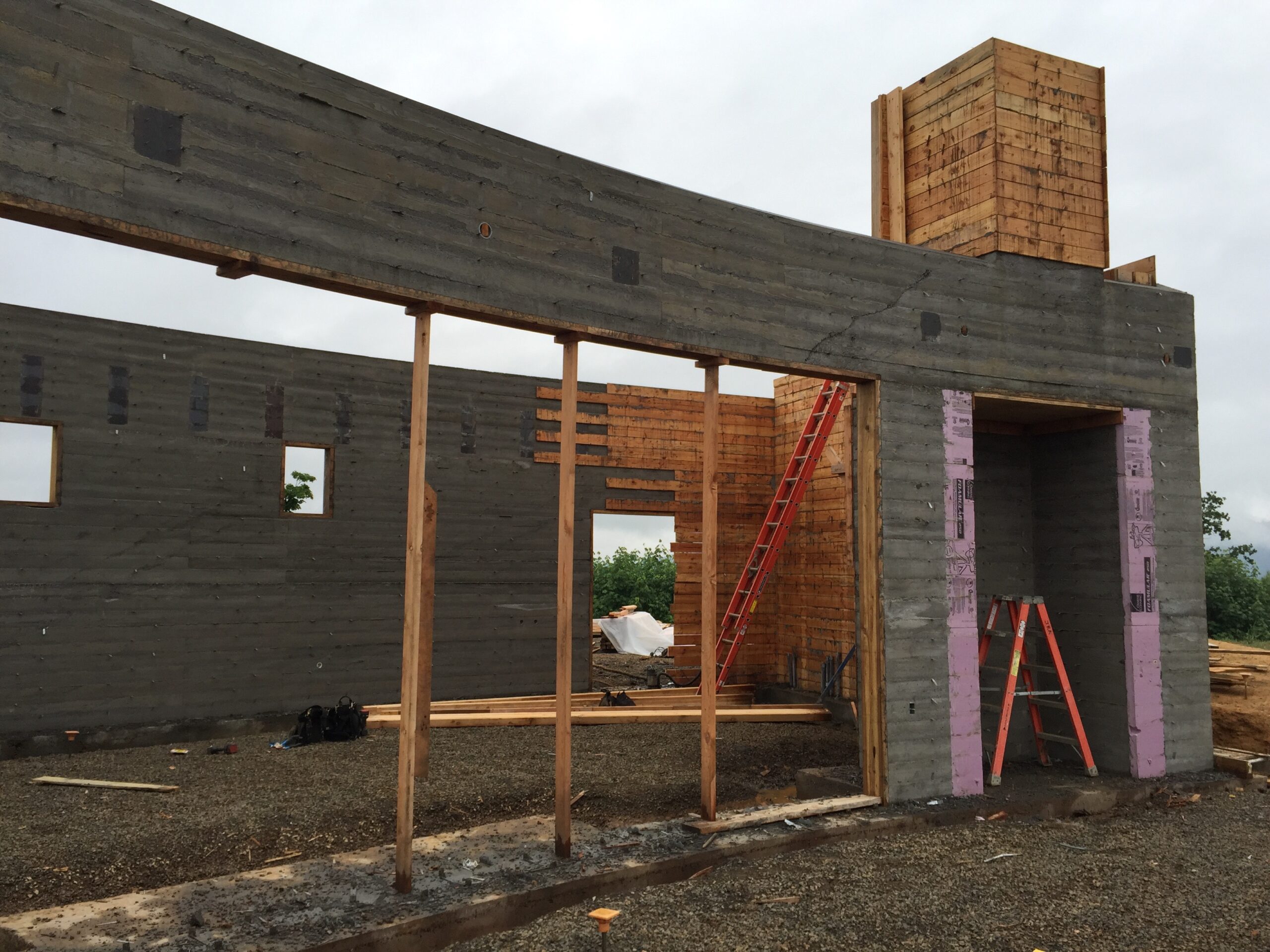 Crews erect support columns for patio roof structure outside the tasting room at Fairsing Vineyard in Oregon's Willamette Valley