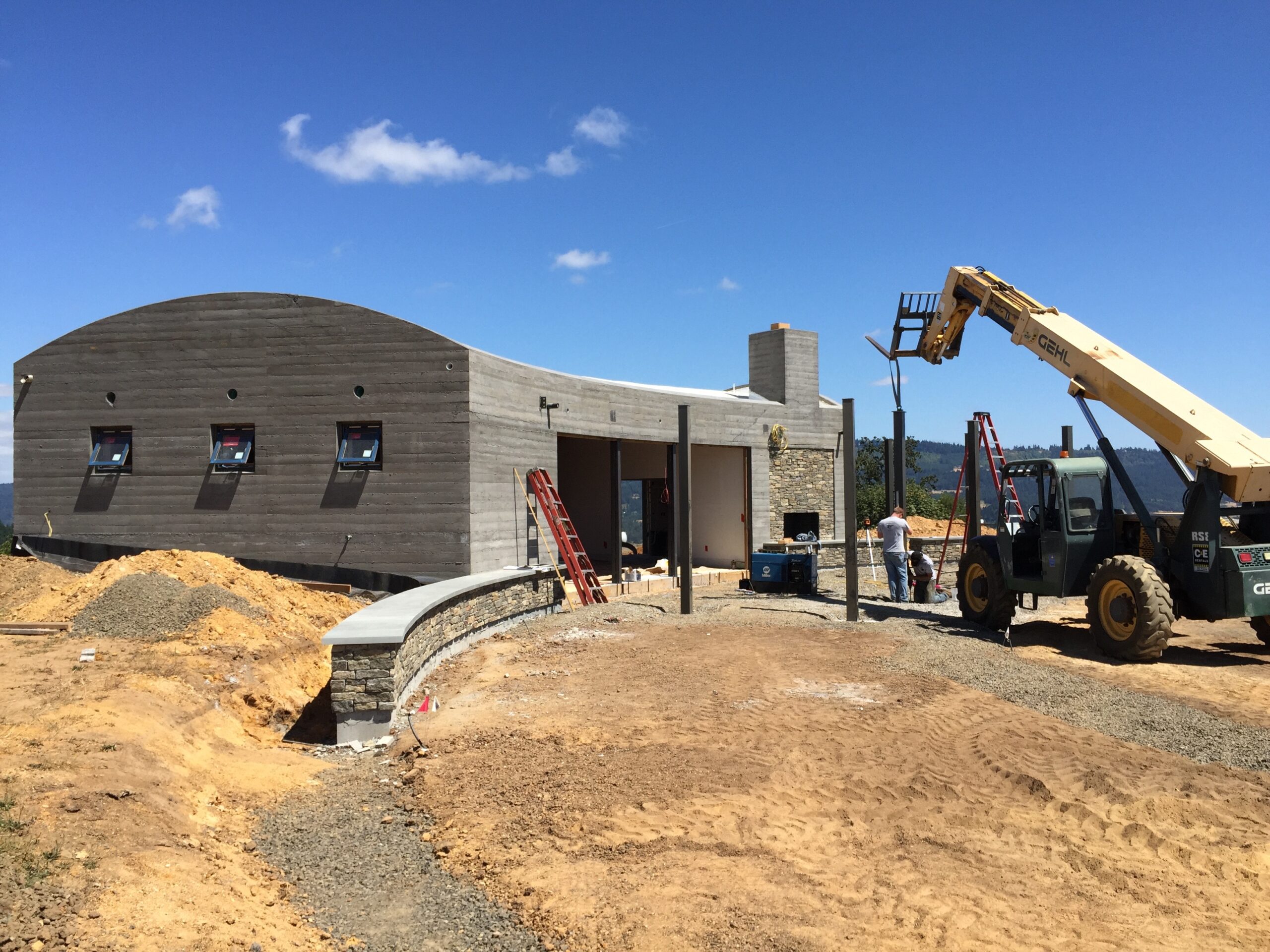 Installing support columns for the patio overhang outside the tasting room at Fairsing Vineyard