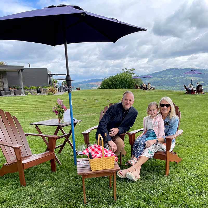 A family enjoys a picnic event at Fairsing Vineyard in Oregon's Willamette Valley