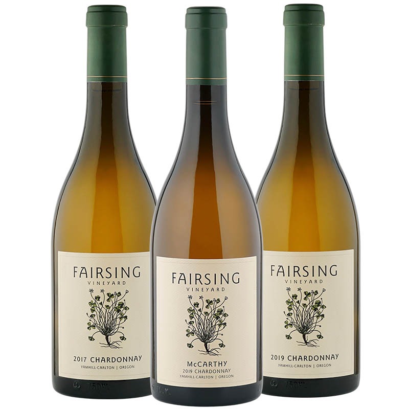 Three bottles of Fairsing Vineyard Chardonnay with white shamrock or clover on the label