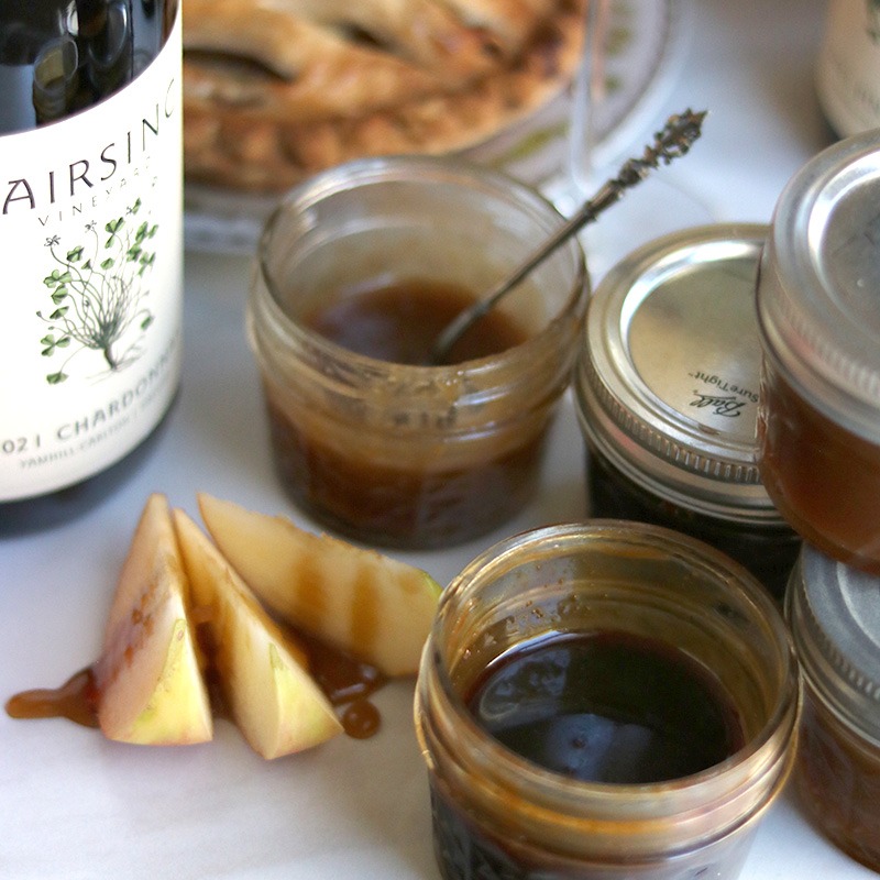 Fairsing Vineyard Chardonnay Caramel Sauce amid apple slices and fruit pies